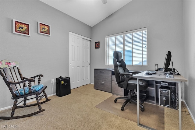 office with baseboards, vaulted ceiling, and light carpet