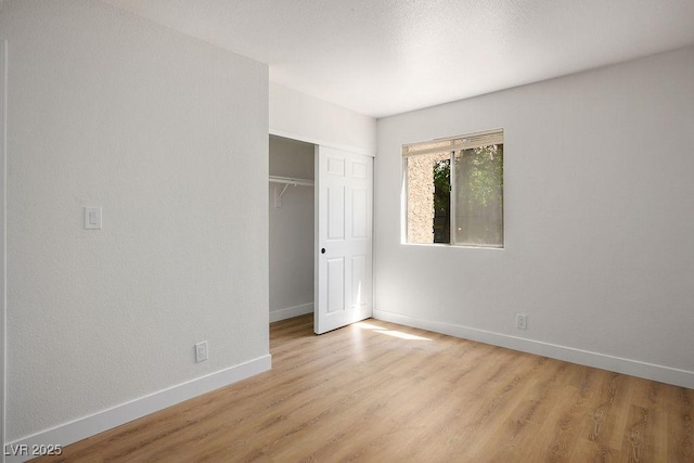 4980 Indian River Dr Unit 447, Las Vegas, NV 89103 - unfurnished bedroom with a closet, light wood-type flooring, and baseboards