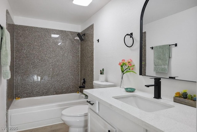 4980 Indian River Dr Unit 447, Las Vegas, NV 89103 - full bathroom featuring vanity, toilet, wood finished floors, and shower / bathing tub combination