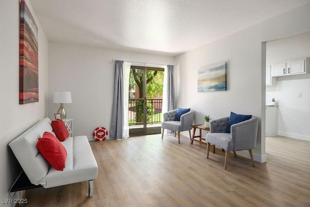 4980 Indian River Dr Unit 447, Las Vegas, NV 89103 - sitting room with baseboards and light wood-style floors