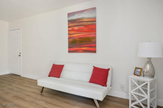 4980 Indian River Dr Unit 447, Las Vegas, NV 89103 - sitting room with baseboards and wood finished floors