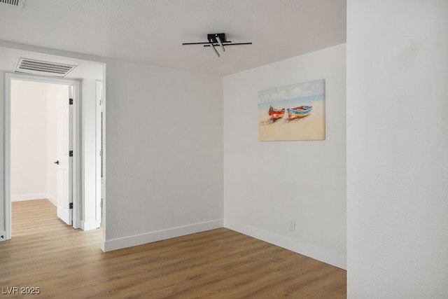 4980 Indian River Dr Unit 447, Las Vegas, NV 89103 - empty room featuring visible vents, wood finished floors, and baseboards