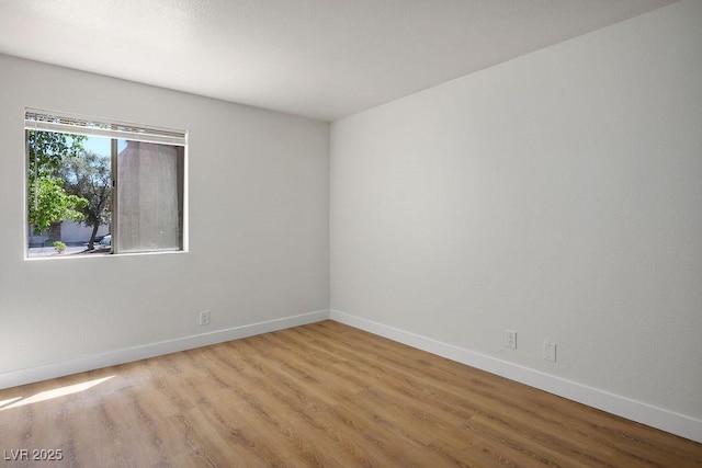 4980 Indian River Dr Unit 447, Las Vegas, NV 89103 - spare room with baseboards and light wood-type flooring