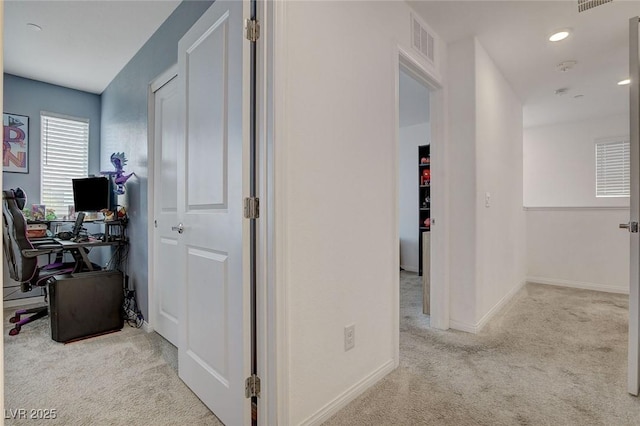 corridor with visible vents, recessed lighting, carpet, and baseboards