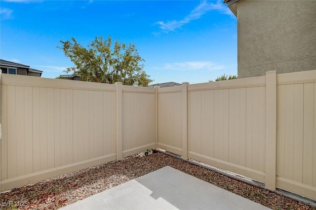 view of yard featuring fence and a patio area