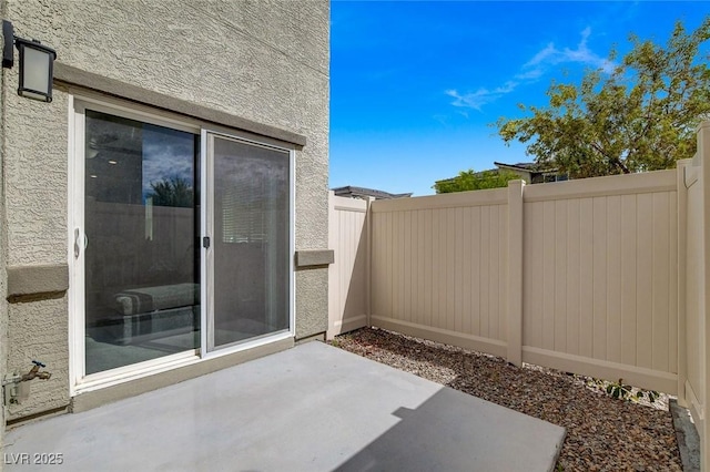 view of patio with fence