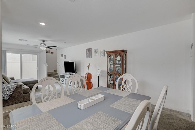 carpeted dining area featuring a ceiling fan, visible vents, and recessed lighting