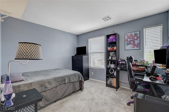 bedroom featuring visible vents, carpet flooring, and baseboards