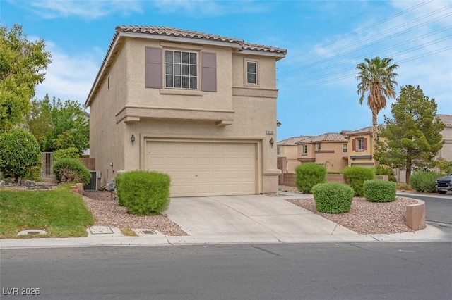 view of front of house with a garage, stucco siding, a tiled roof, and concrete driveway