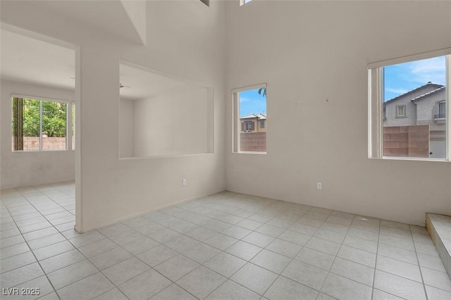 unfurnished room with tile patterned flooring