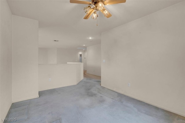 unfurnished room featuring a ceiling fan, visible vents, carpet floors, baseboards, and recessed lighting