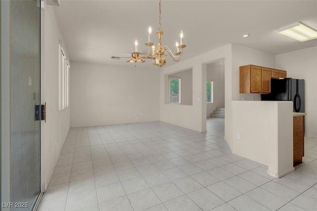 spare room with recessed lighting, light tile patterned flooring, a notable chandelier, and visible vents