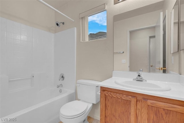 bathroom featuring vanity, shower / bathtub combination, and toilet