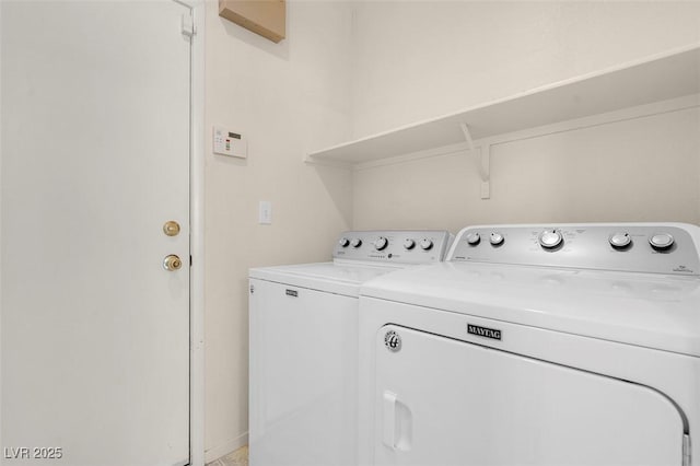 washroom with laundry area and washer and clothes dryer