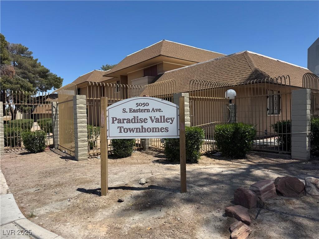 community sign featuring fence