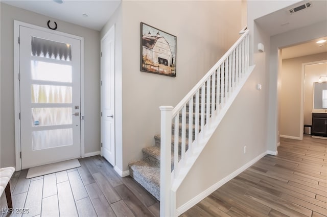 356 Silva Pl, Henderson, NV 89011 - entryway with visible vents, baseboards, stairs, and wood finished floors