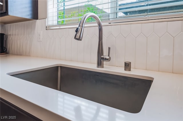 356 Silva Pl, Henderson, NV 89011 - interior details featuring white cabinets, tasteful backsplash, a sink, and light countertops