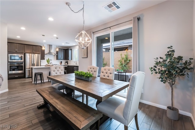 356 Silva Pl, Henderson, NV 89011 - dining area with an inviting chandelier, light wood-style floors, recessed lighting, baseboards, and visible vents