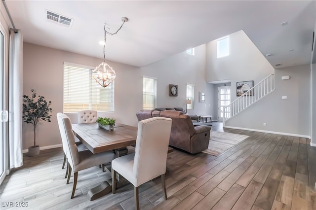 356 Silva Pl, Henderson, NV 89011 - dining space with stairway, baseboards, wood finished floors, and visible vents