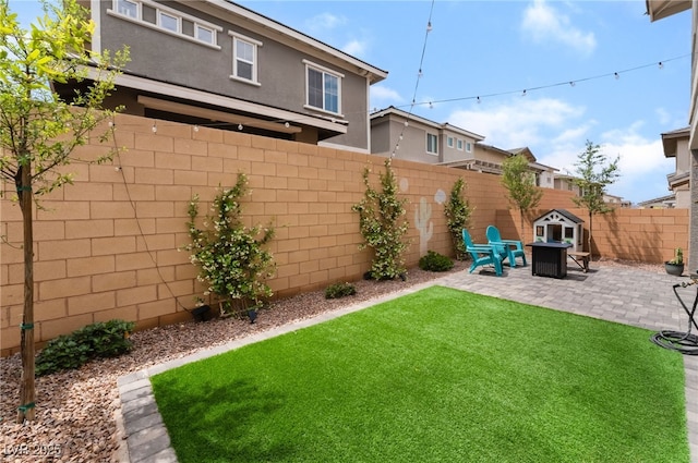 356 Silva Pl, Henderson, NV 89011 - view of yard featuring a fenced backyard, a patio area, and an outdoor fire pit