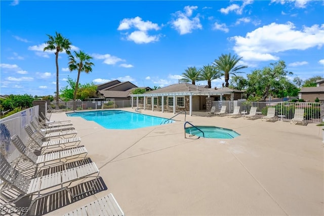 community pool with a community hot tub, a patio area, and fence