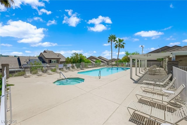 community pool with a patio, a hot tub, fence, and a pergola