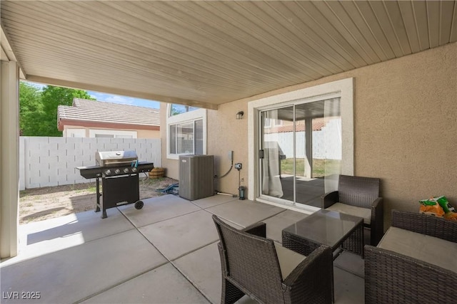 view of patio featuring fence, central air condition unit, an outdoor living space, and area for grilling