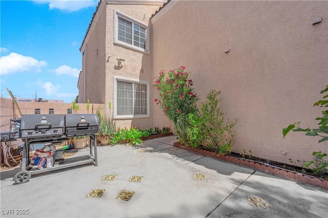 view of patio / terrace with fence and area for grilling