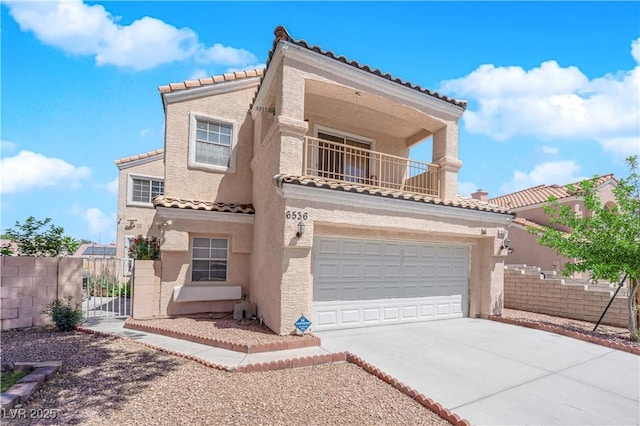 view of front facade featuring fence, a garage, stucco siding, a balcony, and a tiled roof