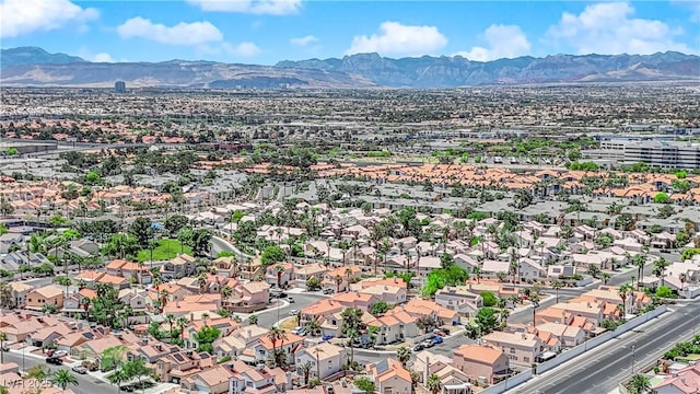 drone / aerial view featuring a residential view and a mountain view