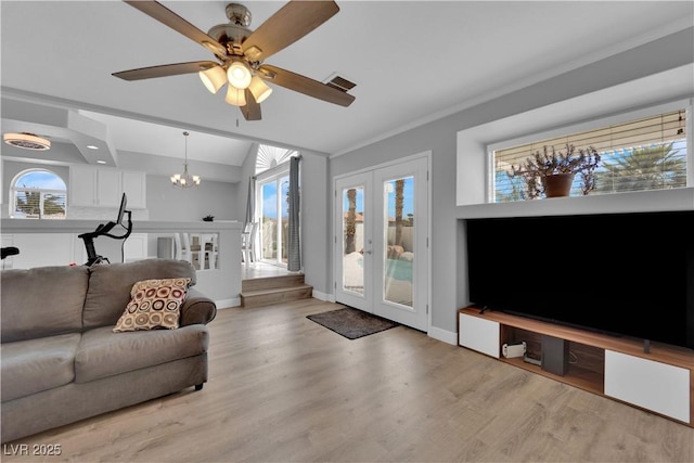 living room with light wood-style floors, baseboards, visible vents, and french doors