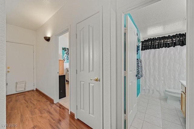hallway featuring light wood-style floors