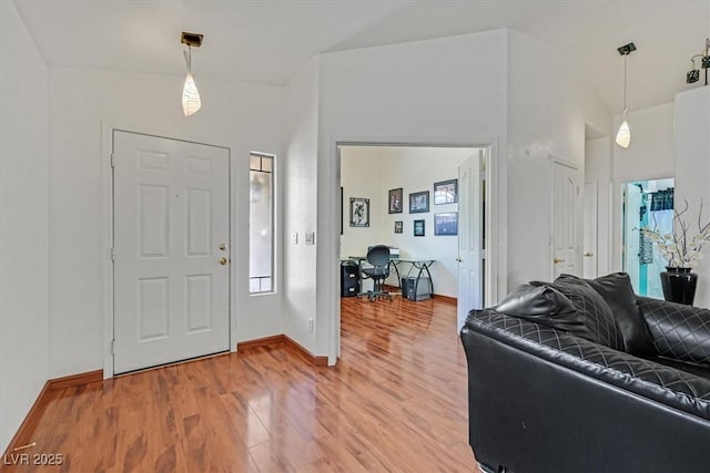 entrance foyer featuring baseboards and light wood-style flooring