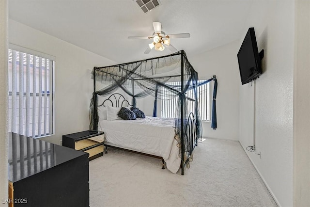 bedroom featuring carpet flooring, ceiling fan, and visible vents