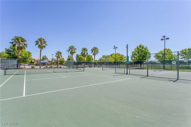 view of sport court featuring fence and community basketball court