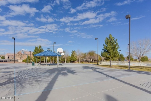 exterior space with a gazebo, fence, and community basketball court