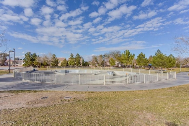 view of property's community featuring fence