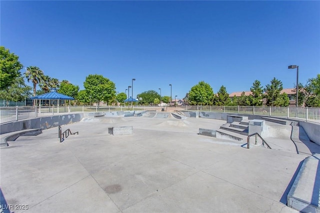 surrounding community featuring fence, a patio, and a gazebo