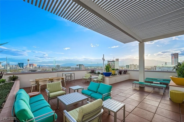 view of patio / terrace with a city view, outdoor dry bar, a pergola, and an outdoor hangout area