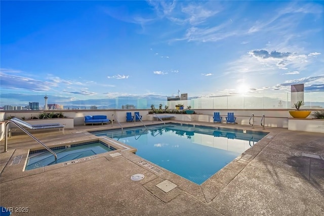 community pool featuring fence, a patio, and a community hot tub