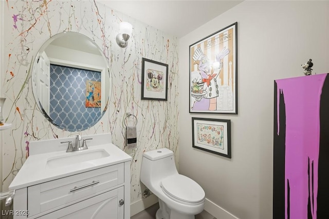150 Las Vegas Blvd Unit 1507, Las Vegas, NV 89101 - half bathroom featuring vanity, toilet, and wallpapered walls