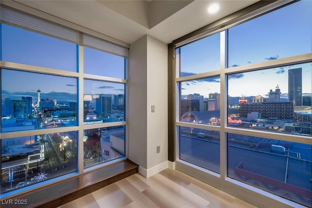 150 Las Vegas Blvd Unit 1507, Las Vegas, NV 89101 - interior space featuring baseboards, a city view, and wood finished floors
