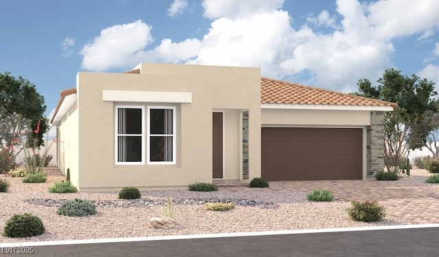 view of front of house featuring a garage, driveway, a tile roof, and stucco siding