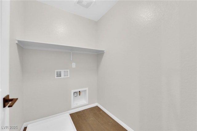 clothes washing area with baseboards, laundry area, washer hookup, and dark wood-type flooring