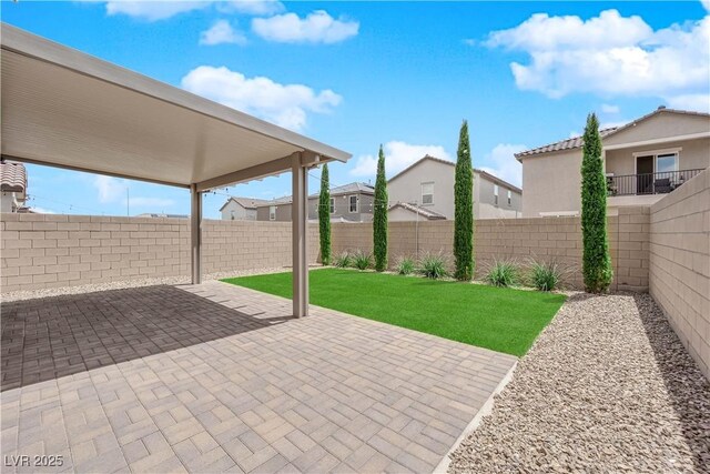 view of patio / terrace featuring a residential view and a fenced backyard