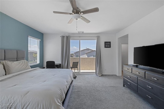 bedroom with access to outside, carpet flooring, visible vents, and multiple windows