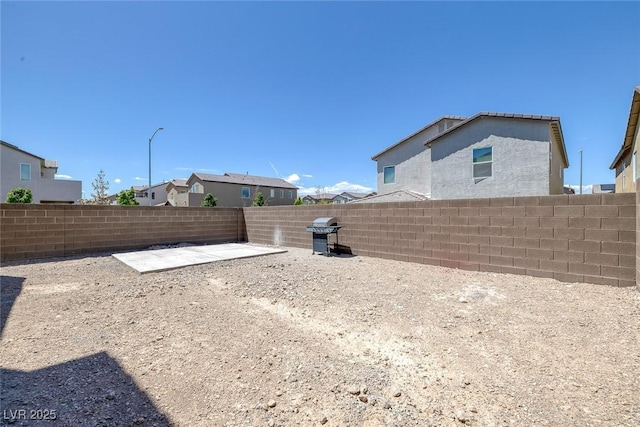 view of yard with a patio and a fenced backyard