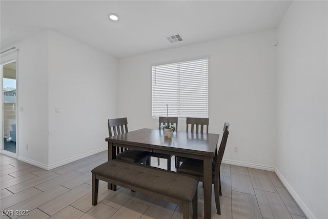 dining room with recessed lighting, baseboards, visible vents, and wood tiled floor