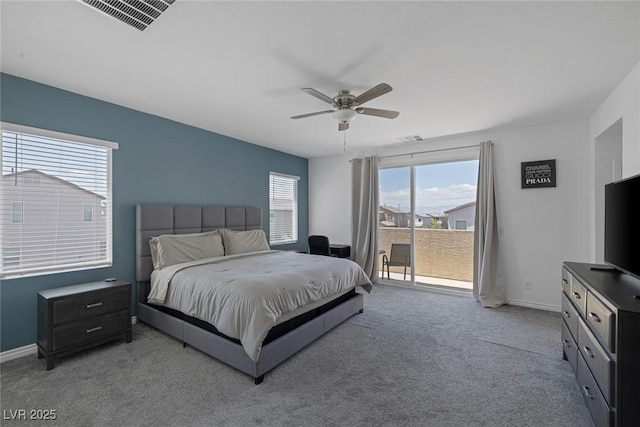 carpeted bedroom featuring baseboards, visible vents, a ceiling fan, and access to exterior