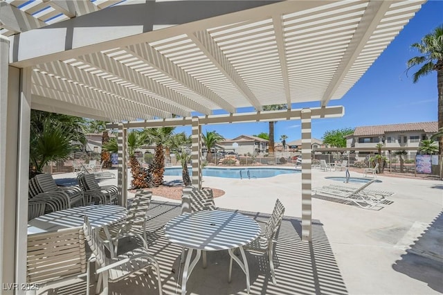 community pool featuring a pergola, fence, and a patio area